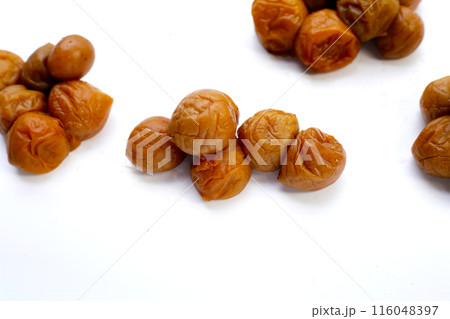 Pickled plums on white background. Pickled plums on white background. 116048397