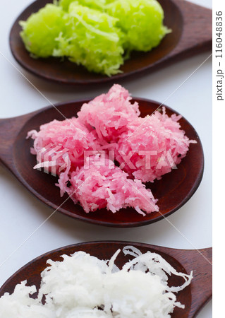 Sweet coconut balls, crispy coconut candies (Maprao Gaew). Thai traditional dessert Sweet coconut balls, crispy coconut candies (Maprao Gaew). Thai traditional dessert 116048836