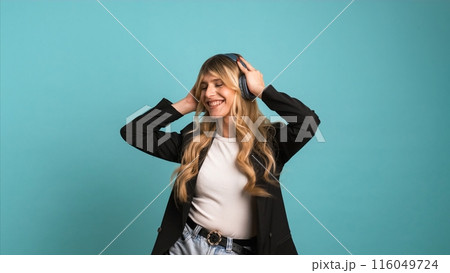 Cheerful transgender businesswoman dancing while listening to music 116049724