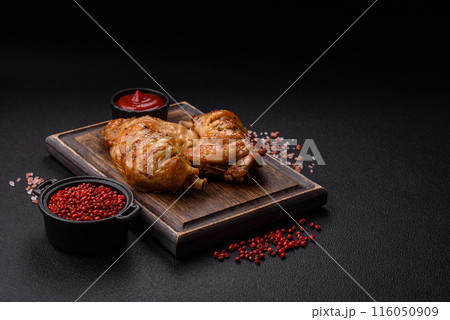 Delicious grilled chicken leg or quarter with salt and spices Delicious grilled chicken leg or quarter with salt and spices 116050909