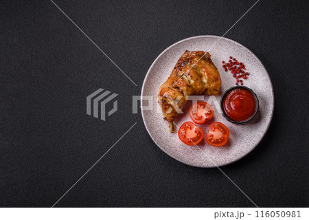 Delicious grilled chicken leg or quarter with salt and spices Delicious grilled chicken leg or quarter with salt and spices 116050981