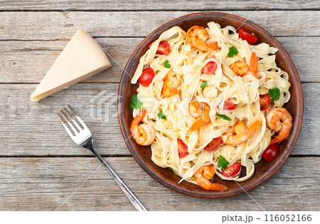 Italian pasta with shrimps , parmesan and tomatoes Italian pasta with shrimps , parmesan and tomatoes 116052166