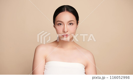Beautiful young asian woman with clean fresh skin on beige background, Face care, Facial treatment, Cosmetology, beauty and spa, Asian women portrait. Beautiful young asian woman with clean fresh skin on beige background, Face care, Facial treatment, Cosmetology, beauty and spa, Asian women portrait. 116052998