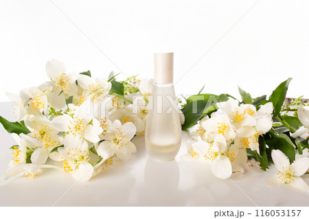 Jasmine essential and Jasmine flowers on white background. Hair treatment concept. Close up 116053157