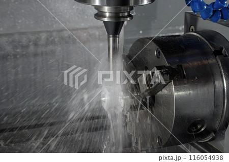 The 4-axis CNC milling machine  cutting the turbocharger part by rotary table. 116054938