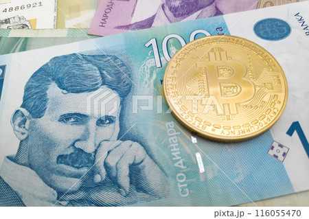 Bitcoin on a stack of Serbian dinar banknotes 116055470