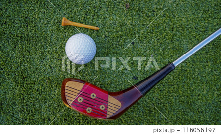 Close up of golf equipment on green grass. Close up of golf equipment on green grass. 116056197