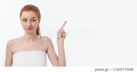 Portrait of caucasian cute in concern and shock, pointing index finger aside, over white background. Portrait of caucasian cute in concern and shock, pointing index finger aside, over white background. 116057086