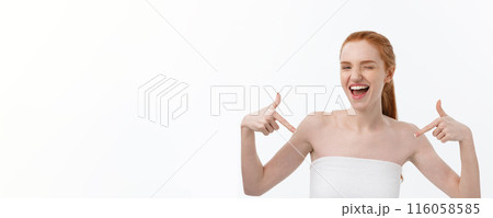Beauty Skin care portrait of young woman showing copy space by hand. 116058585