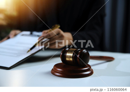 Law theme, gavel or mallet of the judge, lawyer enforcement officers, evidence-based cases taken into account in the court abount business, legislation. Law theme, gavel or mallet of the judge, lawyer enforcement officers, evidence-based cases taken into account in the court abount business, legislation. 116060064