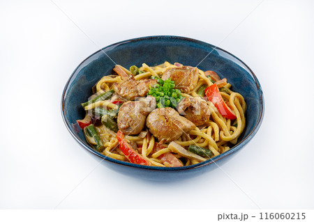 Egg noodles with curry sauce and chicken on a white background 116060215