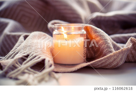 Create a Cozy Candlelit Setting with a Blanket for a Warm and Inviting Home Decor 116062618