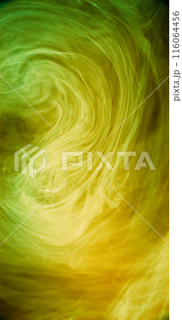 Smoke vortex. Ink cloud. Blur neon yellow green color glowing haze cloud texture paint floating in water dreamlike abstract art background. 116064456
