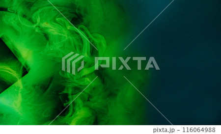 Paint water drop. Explosion cloud. Defocused vivid green blue color dust particles smoke wave flow on black abstract art background. Paint water drop. Explosion cloud. Defocused vivid green blue color dust particles smoke wave flow on black abstract art background. 116064988