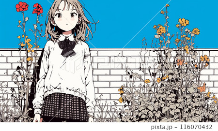 晴天の日にレンガブロックのある花壇の前に立つ少女