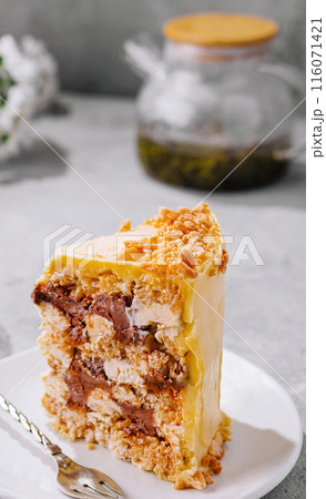 Decadent layered honey cake on modern tabletop Decadent layered honey cake on modern tabletop 116071421