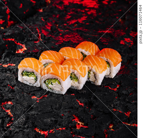 Sushi roll on textured black surface 116071464