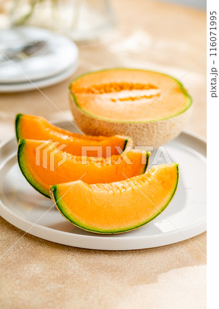 A sweet melon on a plate. A sweet melon on a plate. 116071995