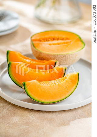 A sweet melon on a plate. A sweet melon on a plate. 116072002