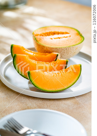 A sweet melon on a plate. A sweet melon on a plate. 116072006