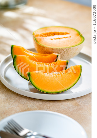 A sweet melon on a plate. A sweet melon on a plate. 116072009