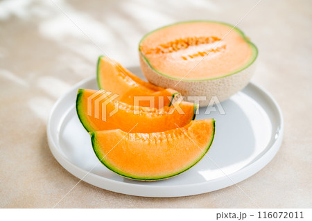 A sweet melon on a plate. A sweet melon on a plate. 116072011