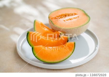 A sweet melon on a plate. A sweet melon on a plate. 116072020