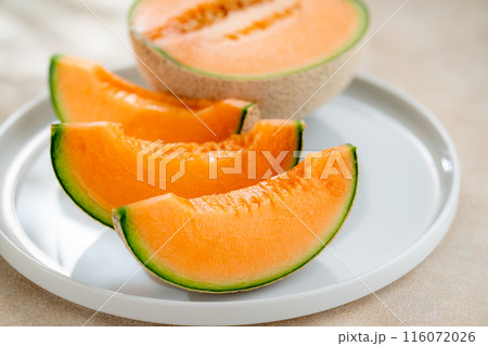 A sweet melon on a plate. A sweet melon on a plate. 116072026