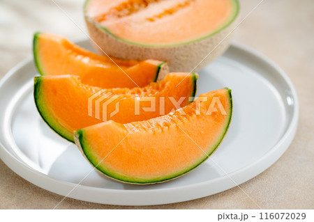 A sweet melon on a plate. A sweet melon on a plate. 116072029