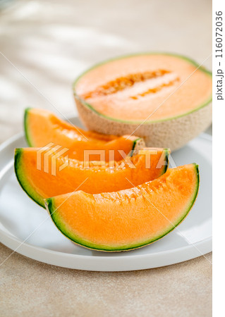 A sweet melon on a plate. A sweet melon on a plate. 116072036