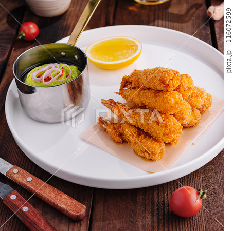 Fried shrimp platter with dipping sauce top view 116072599