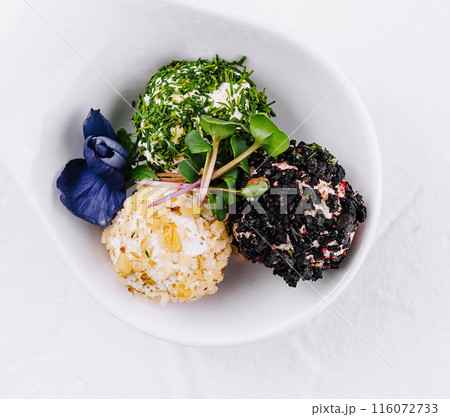 Gourmet cheese balls with herbs on elegant white dish Gourmet cheese balls with herbs on elegant white dish 116072733