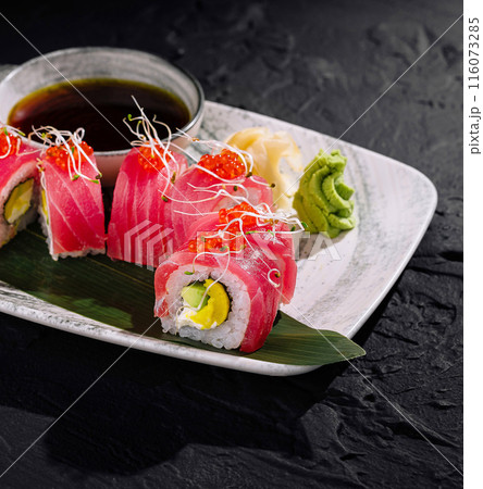 Exquisite tuna sushi roll on dark slate background Exquisite tuna sushi roll on dark slate background 116073285