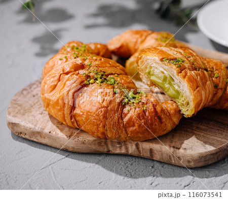 Fresh pistachio croissants on table close up 116073541