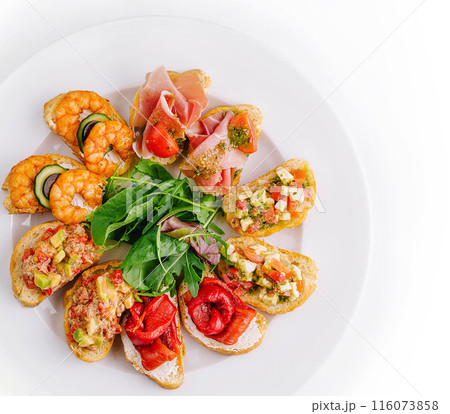 Gourmet bruschetta platter on white background Gourmet bruschetta platter on white background 116073858