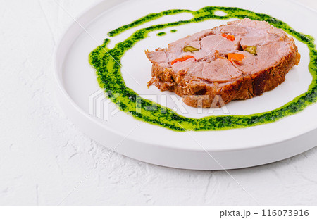 Gourmet roasted pork with herb sauce 116073916
