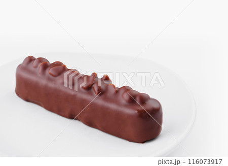 Chocolate bar on white plate isolated on white background 116073917