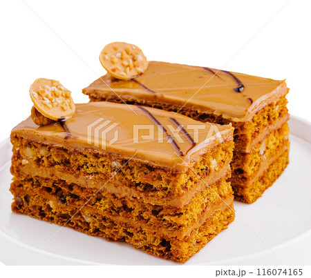 Gourmet peanut butter cake slices on white plate 116074165