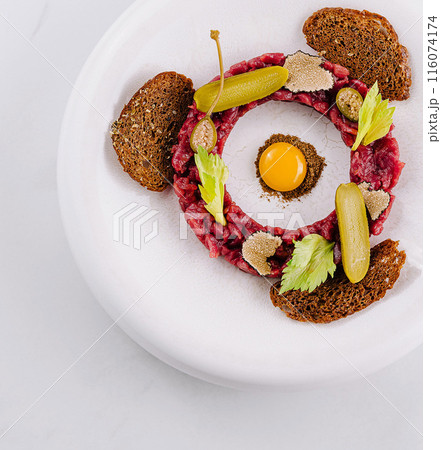 Gourmet steak tartare with quail egg Gourmet steak tartare with quail egg 116074174