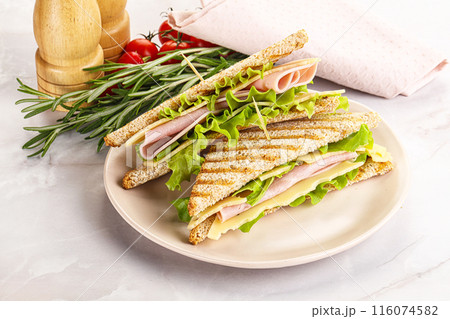 Homemade club sandwich with ham and cheese 116074582