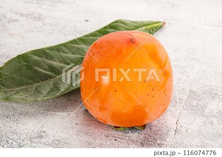 Fresh ripe sweet juicy persimmon Fresh ripe sweet juicy persimmon 116074776