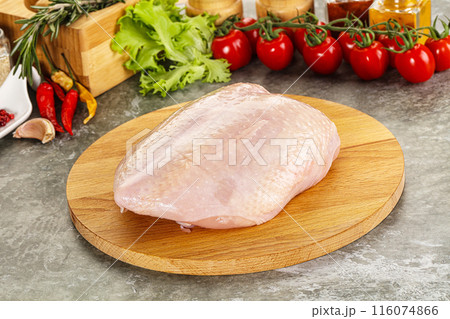 Raw chicken breast with skin 116074866