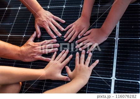 Hands on solar panel. Rooftop solar or photovoltaic system. Sustainable future for next generation. Hands on solar panel. Rooftop solar or photovoltaic system. Sustainable future for next generation. 116076282