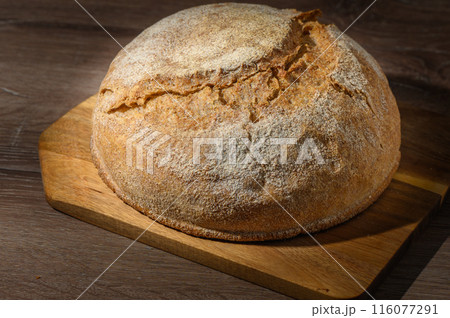 Concept of homemade bread, natural farm products, domestic production. Concept of homemade bread, natural farm products, domestic production. 116077291