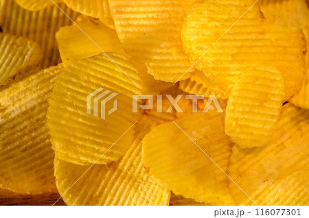 Full frame foodbackground of potato chips, top view Full frame foodbackground of potato chips, top view 116077301