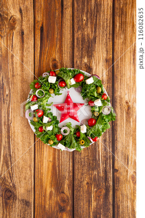 Christmas wreath salad on dark background Christmas wreath salad on dark background 116082635