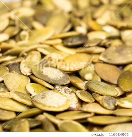 Peeled pumpkin seeds, kernels close-up 116084903