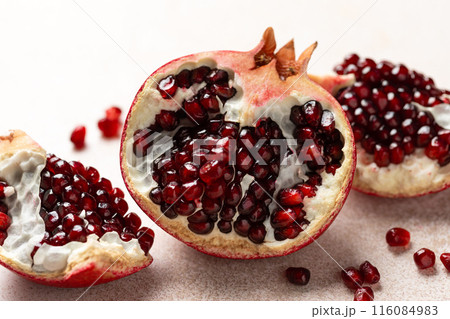 Pomegranate. Fresh organic juicy pomegranate fruit pieces. Pomegranate seeds, grains. 116084983