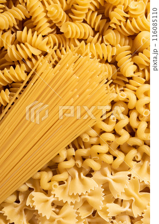 Variety of types and shapes of dry Italian pasta, top view 116085110