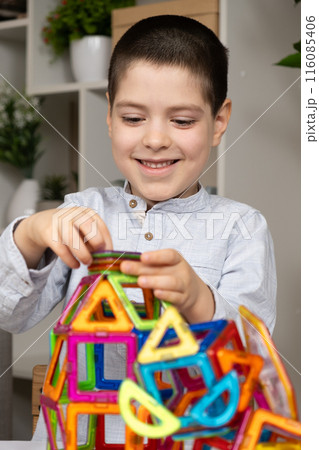 A child plays with a magnetic construction set. Interesting educational toys. 116085406